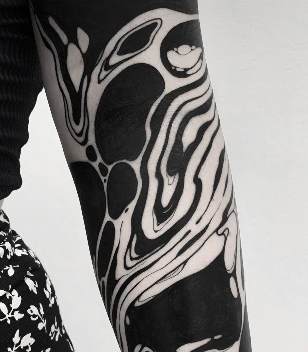 Cover Up Tattoo Pattern: 9 Ways to Hide Old Ink or Scars 6 Abstract black and white organic pattern tattoo covering a person's arm.