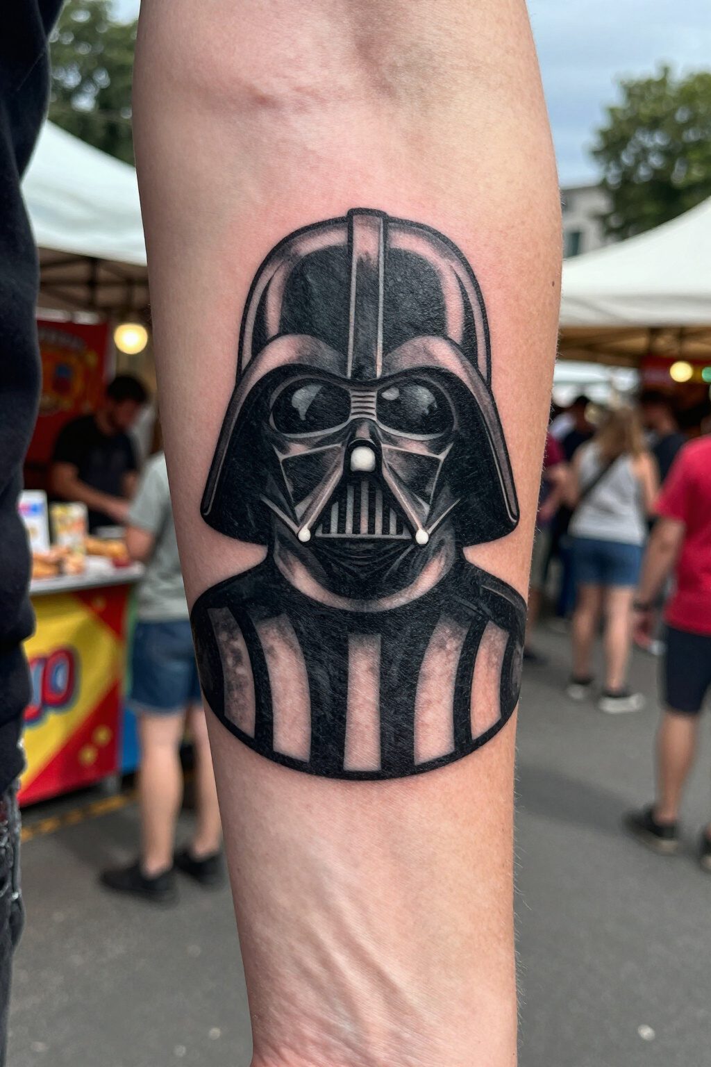 Darth Vader Tattoo: Styles, Meanings and Design Ideas 5 Silhouette tattoo of Darth Vader's helmet on bare skin.