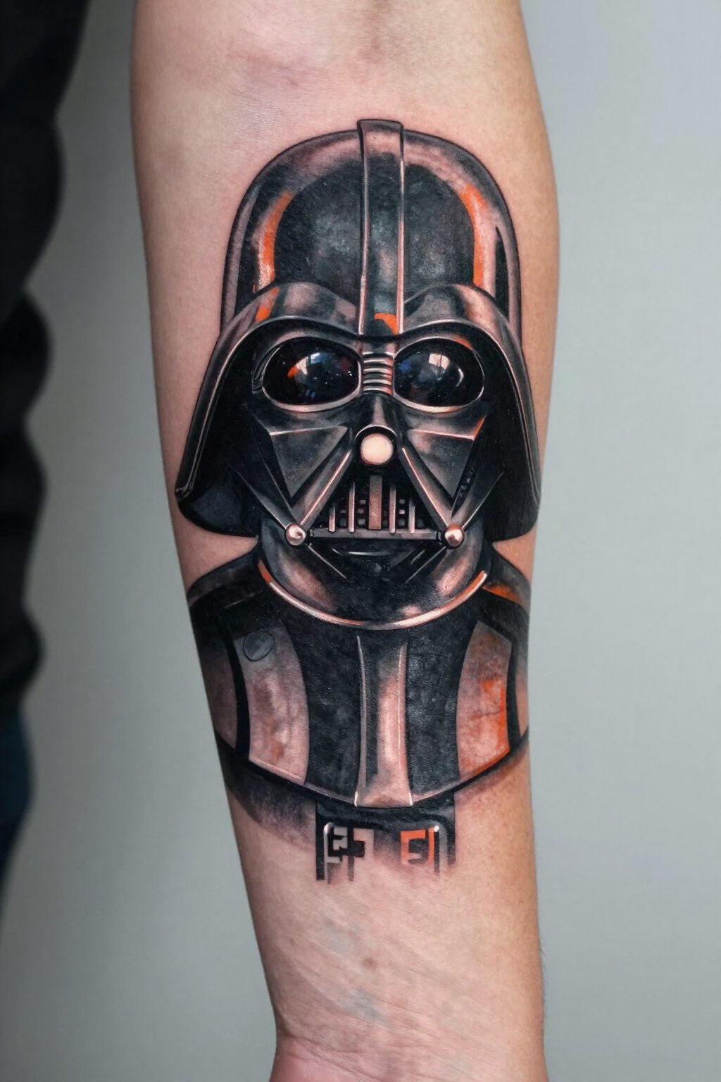 Darth Vader Tattoo: Styles, Meanings and Design Ideas 1 Realistic portrait tattoo of Darth Vader's helmet on a forearm.