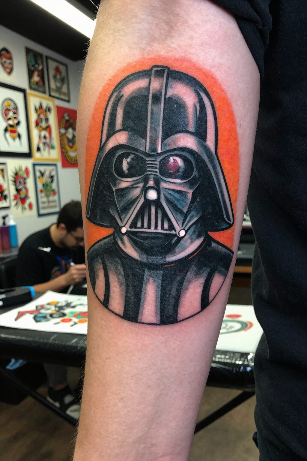 Darth Vader Tattoo: Styles, Meanings and Design Ideas 3 Traditional tattoo of Darth Vader's helmet with orange and black shading.