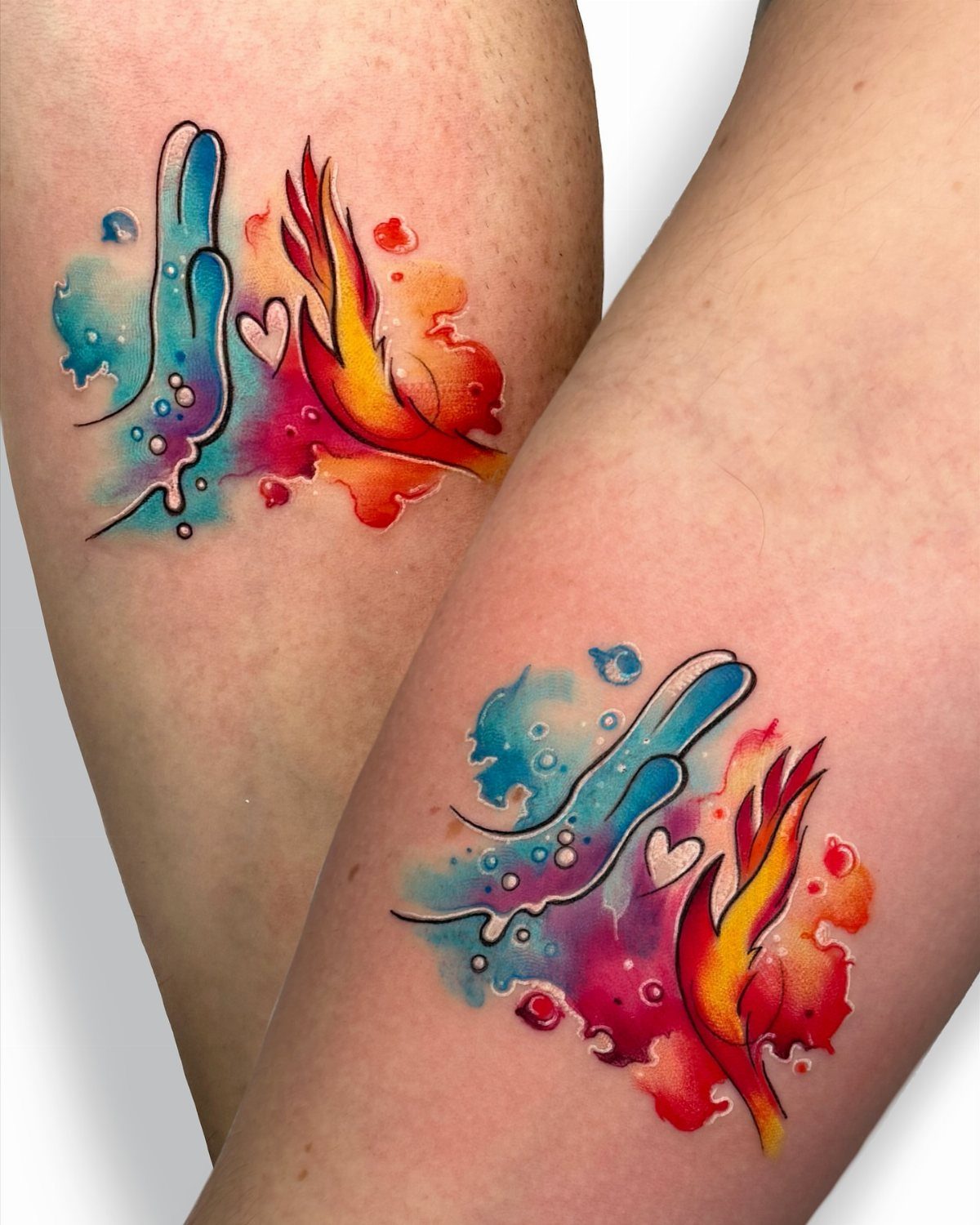 11 Elemental Tattoo Ideas for Your Next Ink 9 Two vibrant watercolor tattoos depicting elemental water and fire designs on human skin.