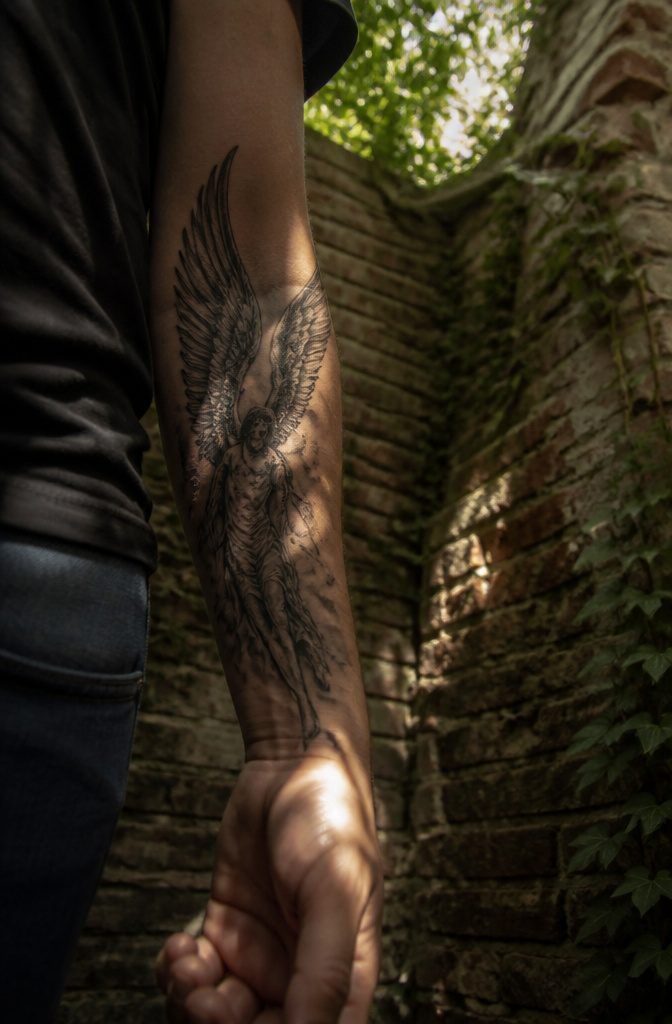 Guardian Angel Fairy Tattoos: 7 Styles From Gothic to Fallen 7 Fallen angel tattoo featuring defiant posture and dark wings.