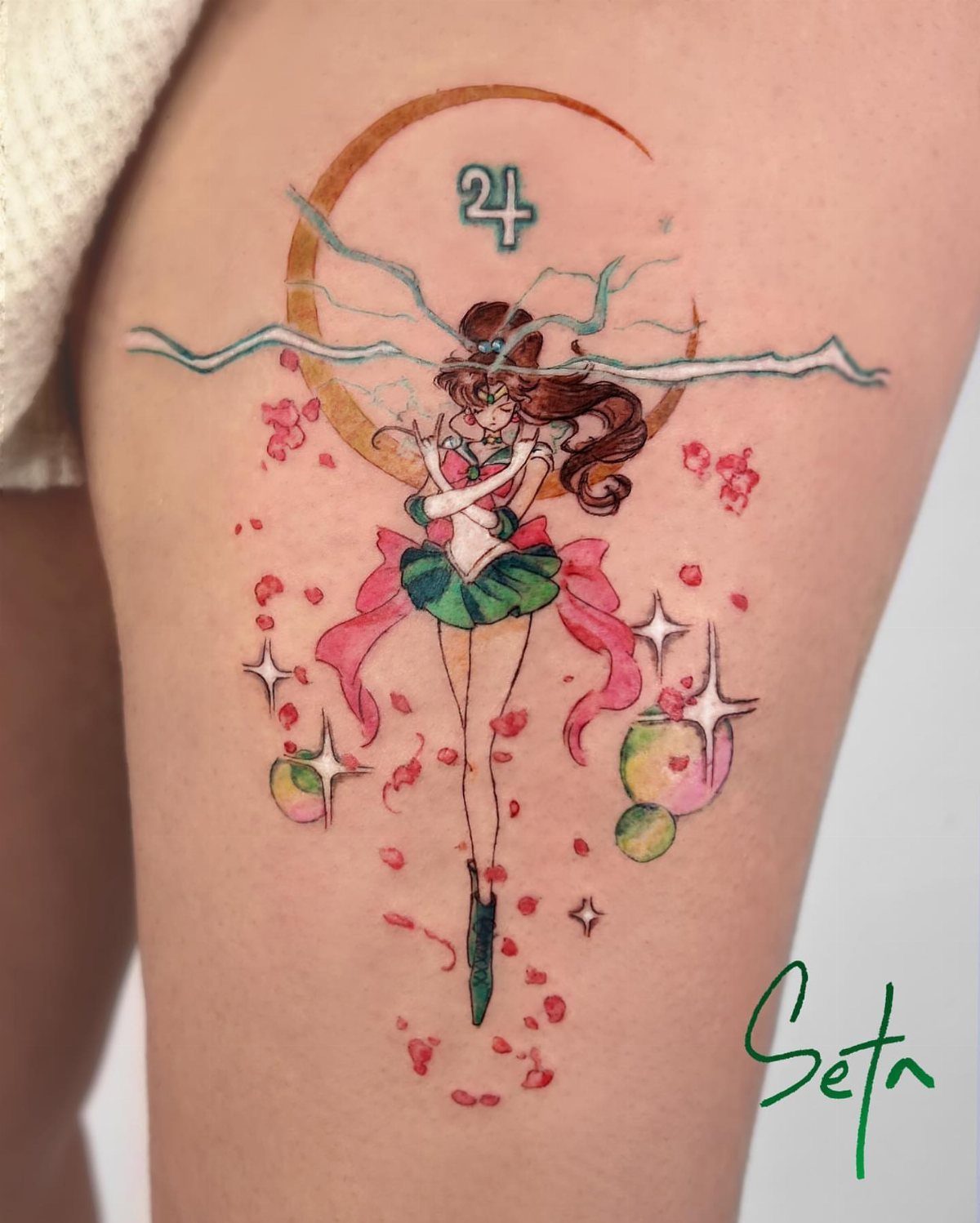 5 Jupiter Tattoo Ideas for Celestial Ink That Stands Out 2 A watercolor tattoo of the anime character Sailor Jupiter with lightning and pink petals.