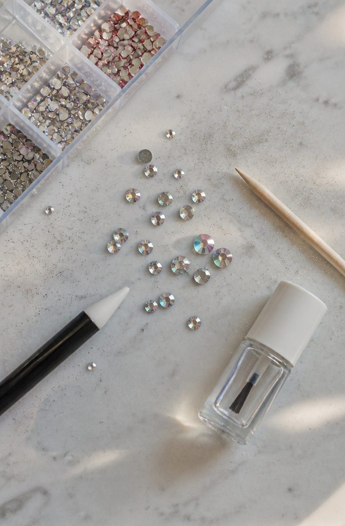 Rhinestone Nail Designs: 11 Ideas for Every Style 13 Tools and materials needed for rhinestone nail application displayed together.
