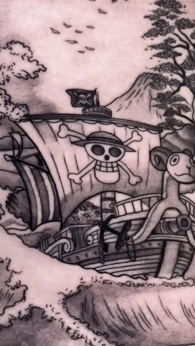 16 Ship Tattoo Ideas in Anchor, Viking, Pirate and Seascape Styles 16 A black and grey tattoo of a sailing ship with a skull and crossbones flag on the sail.