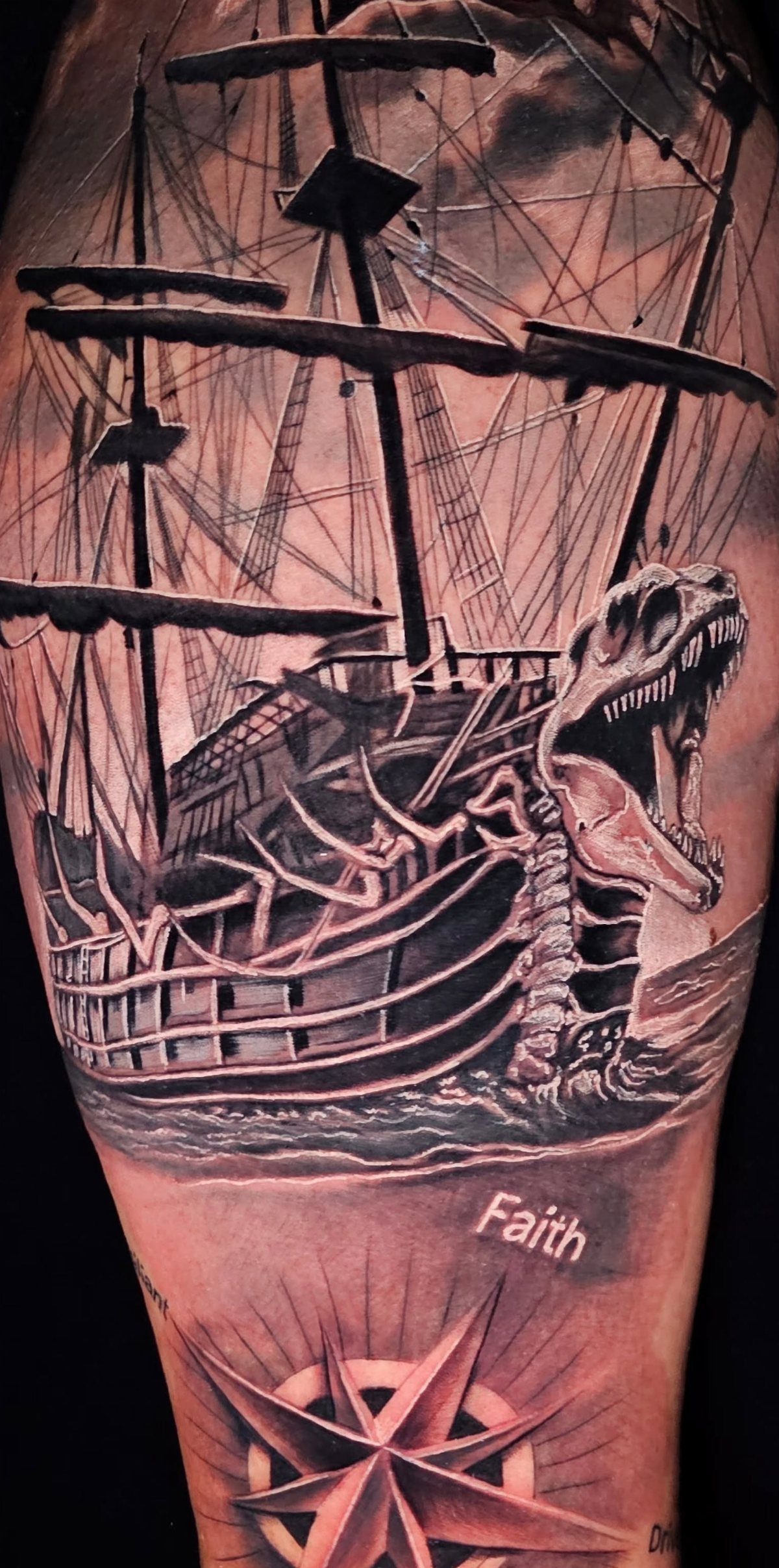 16 Ship Tattoo Ideas in Anchor, Viking, Pirate and Seascape Styles 13 A large black and grey tattoo of a skeletal pirate ship and a compass rose on skin.