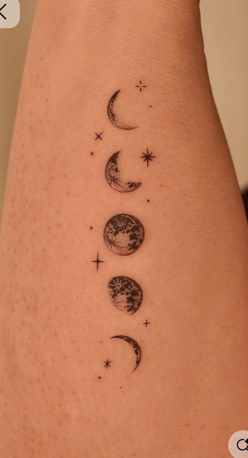 7 Simple Moon Phase Tattoo Designs for Every Style 5 A vertical moon phase tattoo with stippled shading and small stars on human skin.