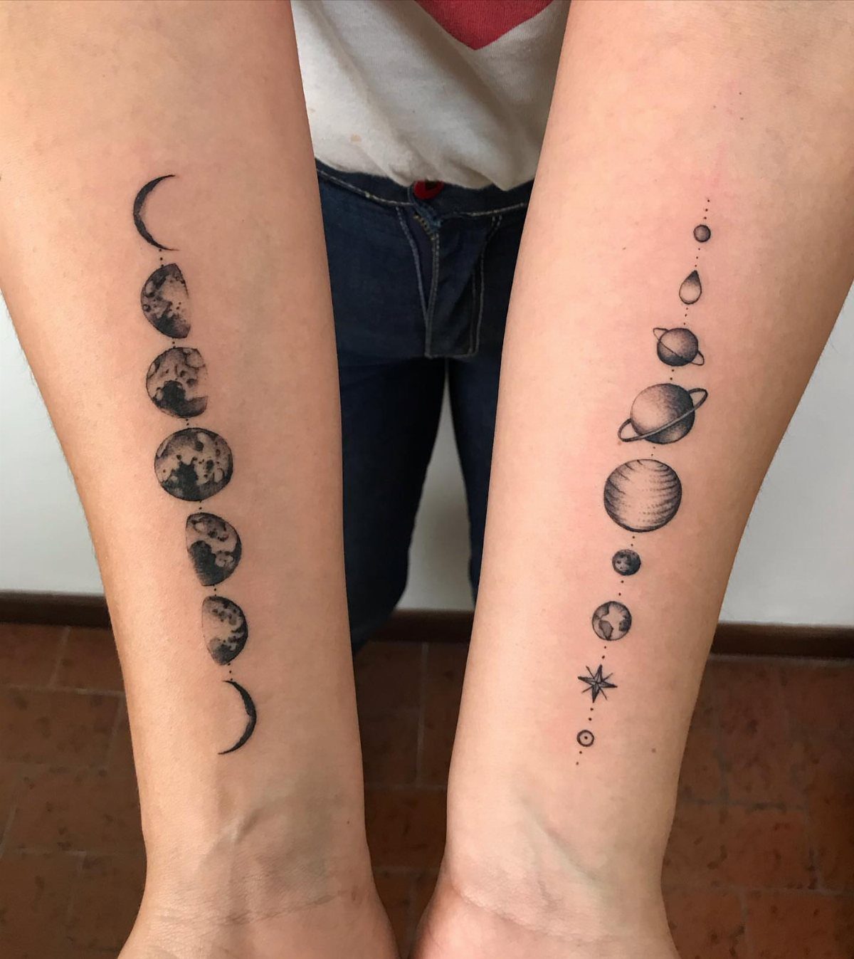 7 Simple Moon Phase Tattoo Designs for Every Style 1 Two forearms displaying vertical black ink tattoos of moon phases and celestial planets.