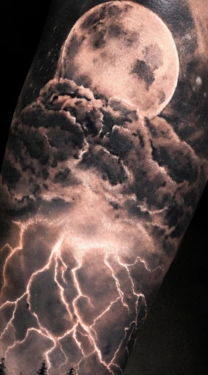 Storm Tattoo: 8 Nature-Inspired Designs for Your Next Ink 1 A realistic tattoo of a full moon, dark storm clouds, and bright lightning bolts.