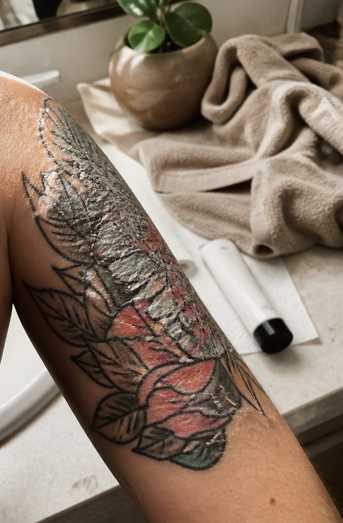 Tattoo Healing: A 5-Step Guide to the First Month 3 Close-up of a healing tattoo with tight skin and light scabbing.